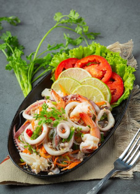 spicy-mixed-seafood-salad-with-thai-food-ingredients_1150-26436